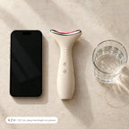 Loomi Glide lying beside a smartphone and a glass of water to show its size: 6.2 inches (15.7 cm) long.