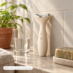 Loomi Glide standing on a stone bathroom shelf beside a glass of water and a bar of soap: about 6.2 inches tall.