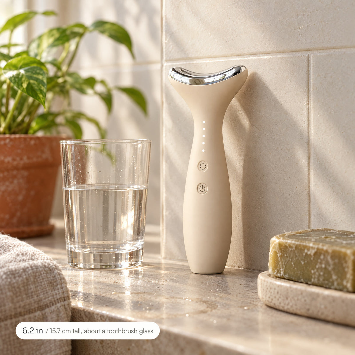 Loomi Glide standing on a stone bathroom shelf beside a glass of water and a bar of soap: about 6.2 inches tall.